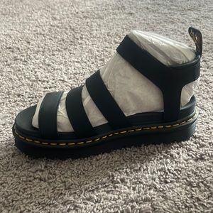 Dr. Martens AirWair sandals.